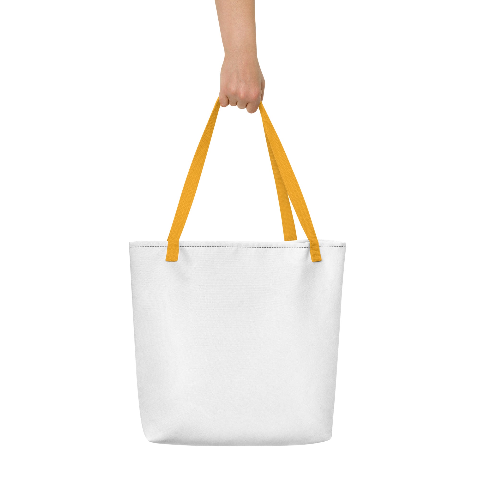 Minimalist white tote bag with bright yellow handles, held up by a hand against a plain white background.